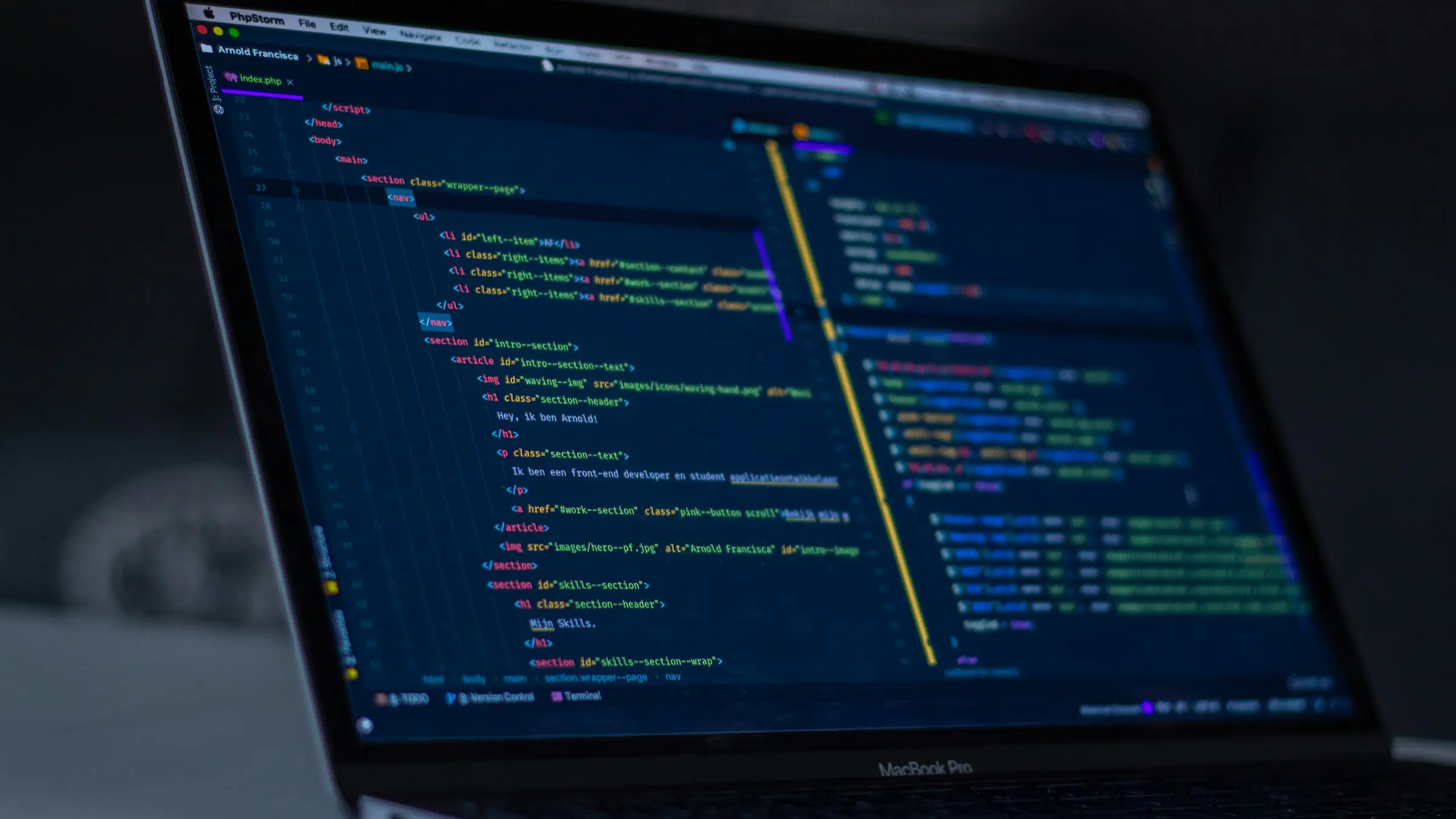 Laptop screen showing code in a dark editor