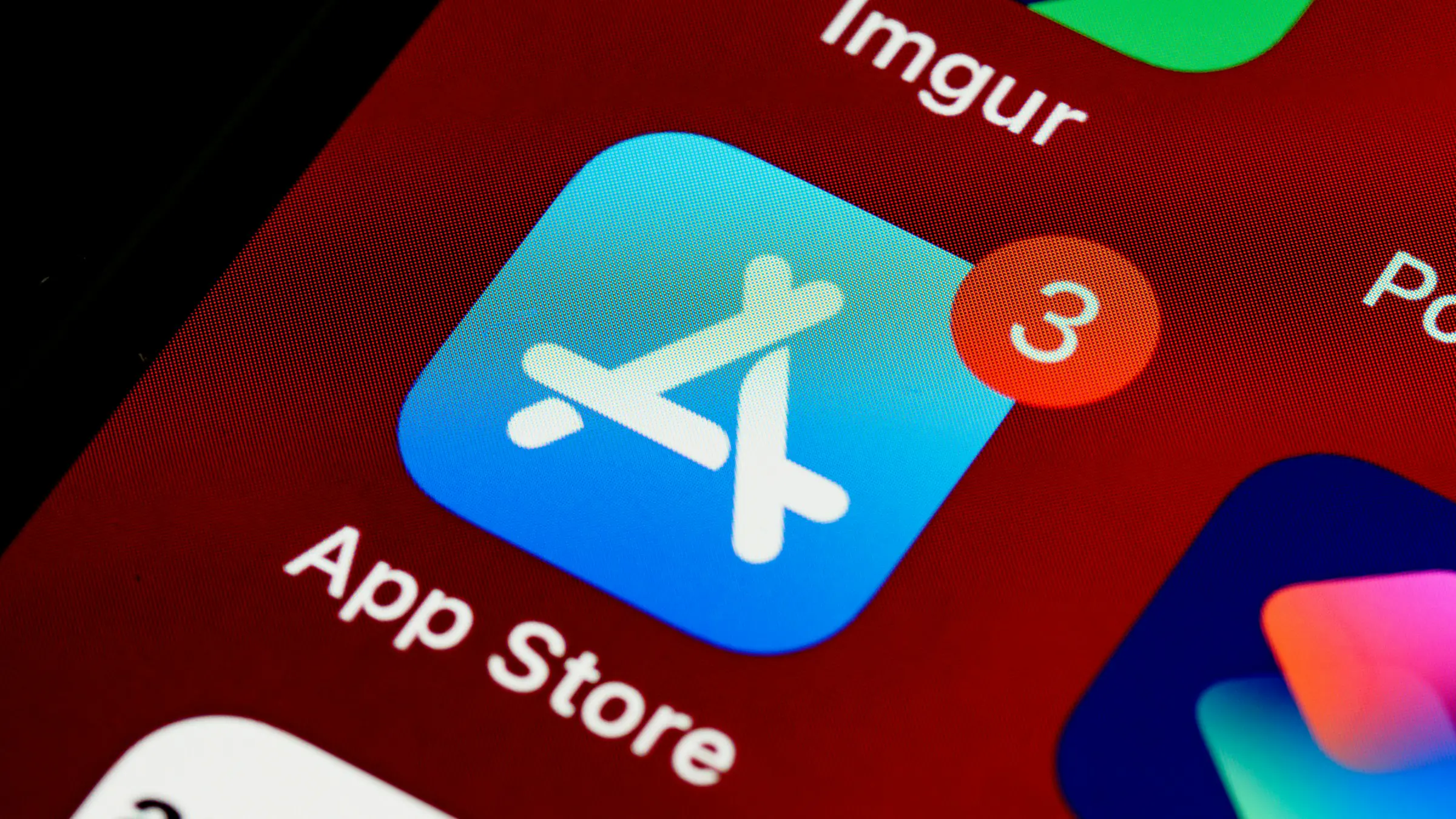 App Store icon with a notification badge on a phone screen