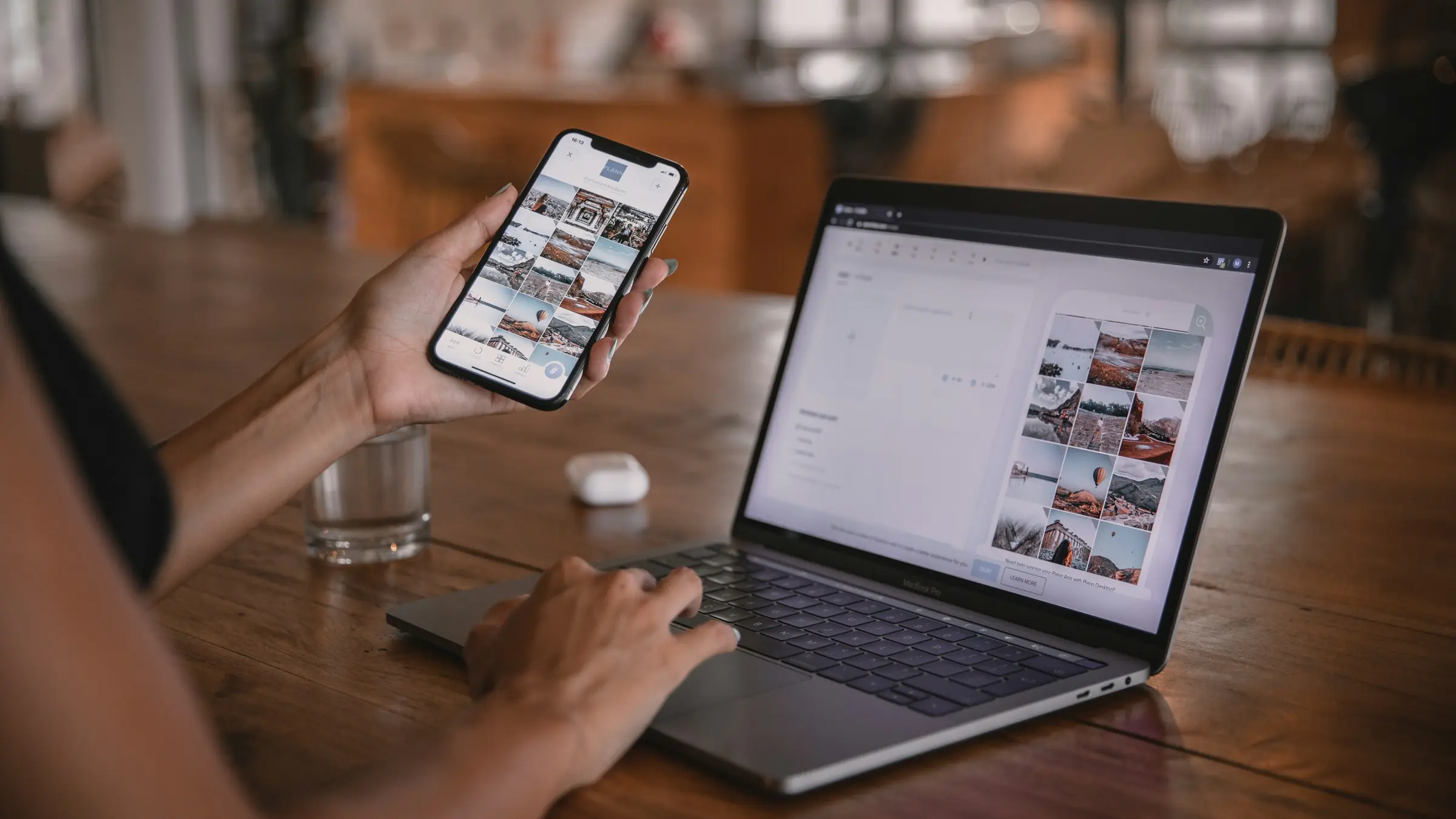 Person using a phone and a laptop at the same time