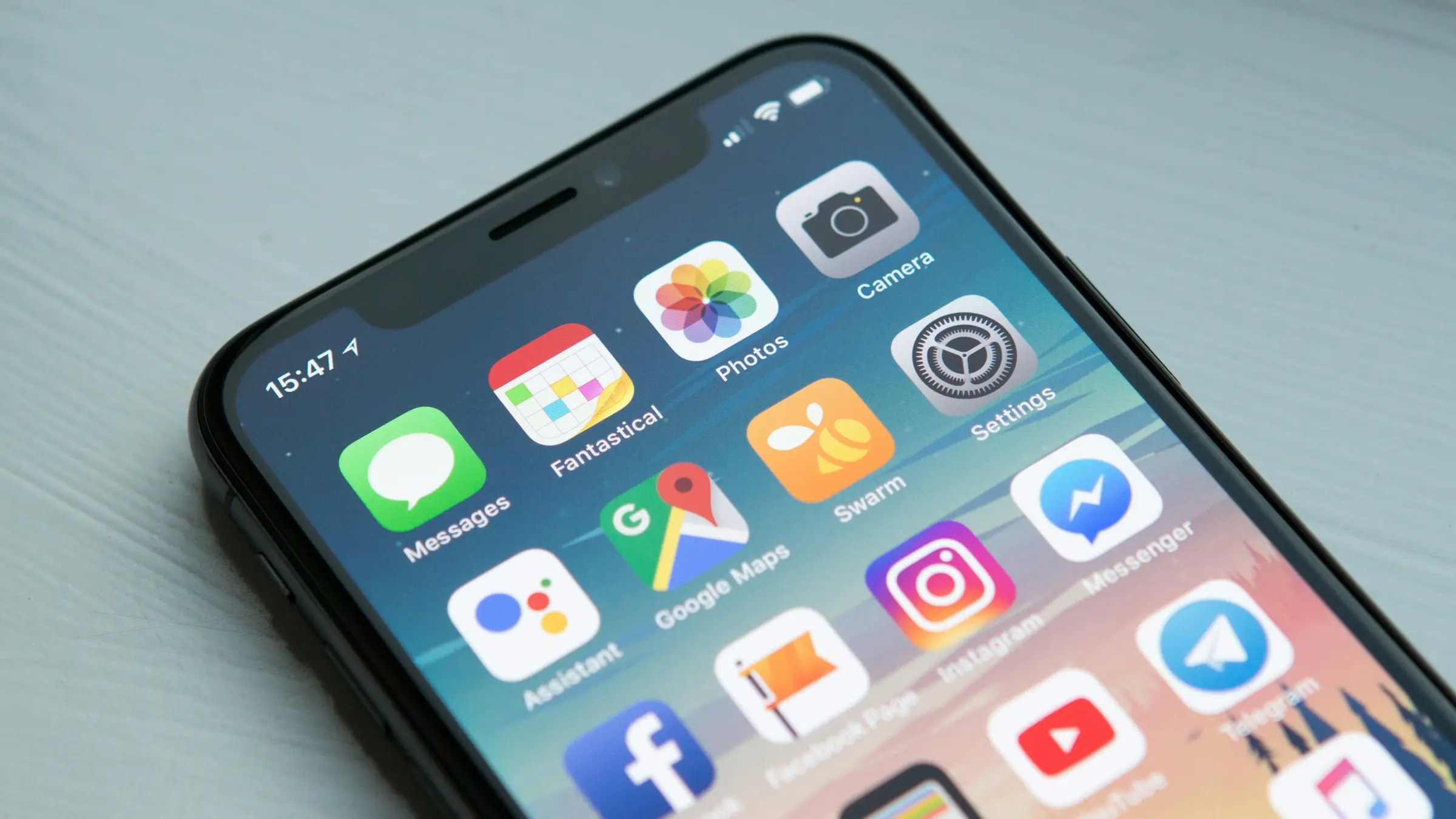 Smartphone home screen full of app icons
